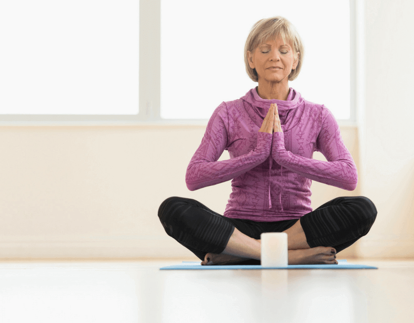Woman practicing yoga for self-care